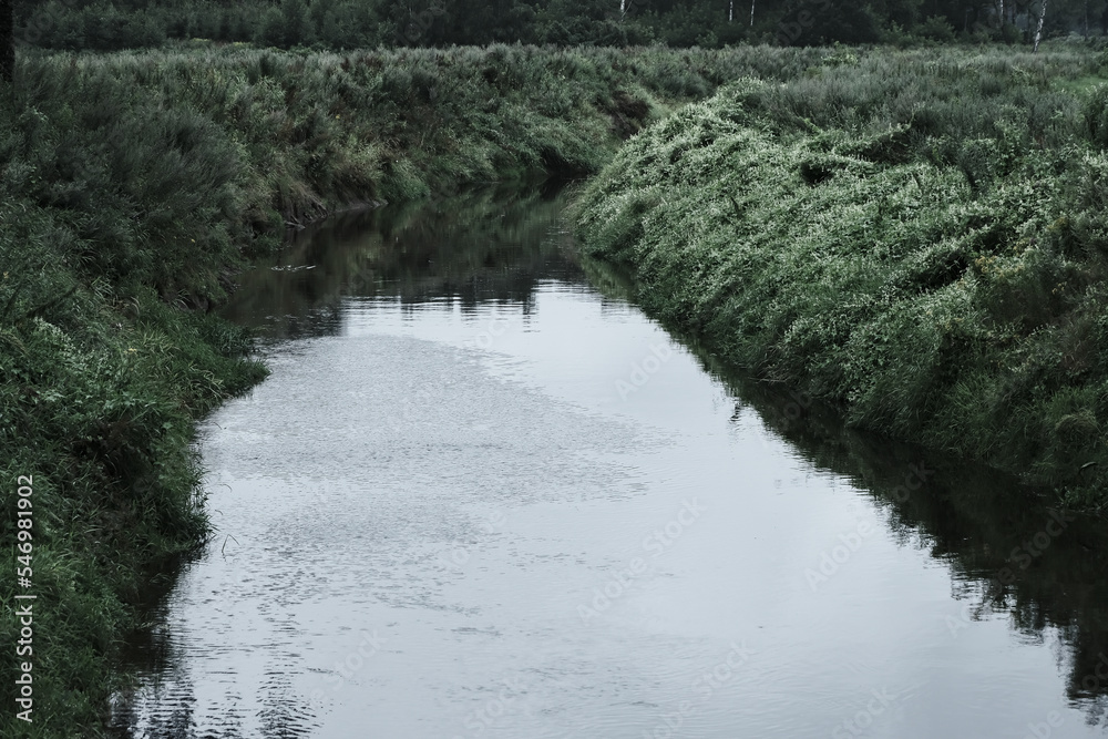 Straight calm river quietly flows forward. Summer rainy day landscape, Latvia, Iecava river, Straight calm river quietly flows forward. Summer rainy day landscape, Latvia, Iecava river,