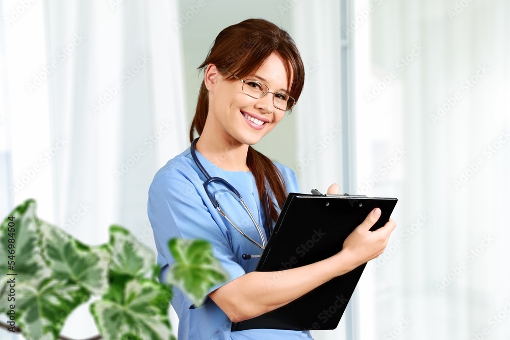 Young happy female doctor in clinic Young happy female doctor in clinic