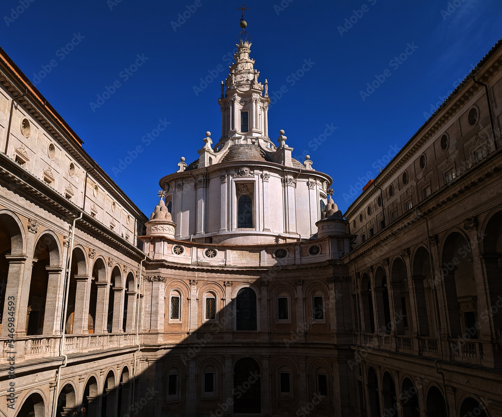 Facade of the San'Ivo complex with the diagonal signs of the shadows, Sant'ivo alla Sapienza, Rome, Lazio, Italy