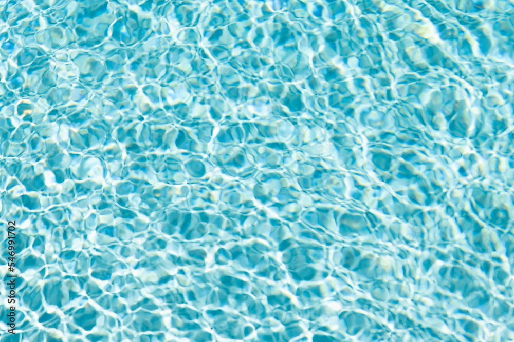 rippled underwater background turquoise color in summer swimming pool