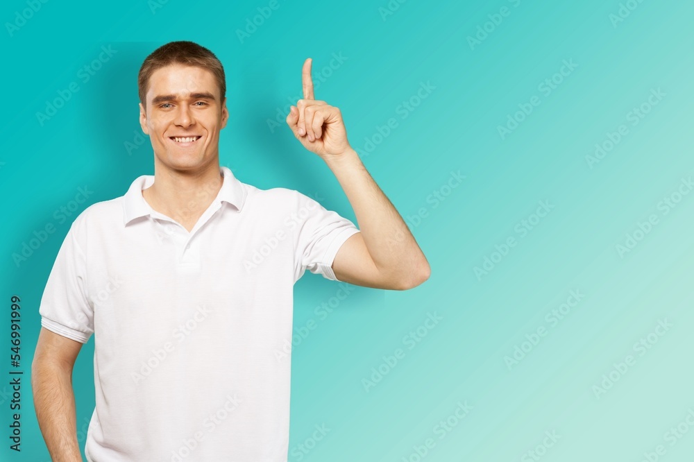 Happy young handsome man fingers pointing Happy young handsome man fingers pointing