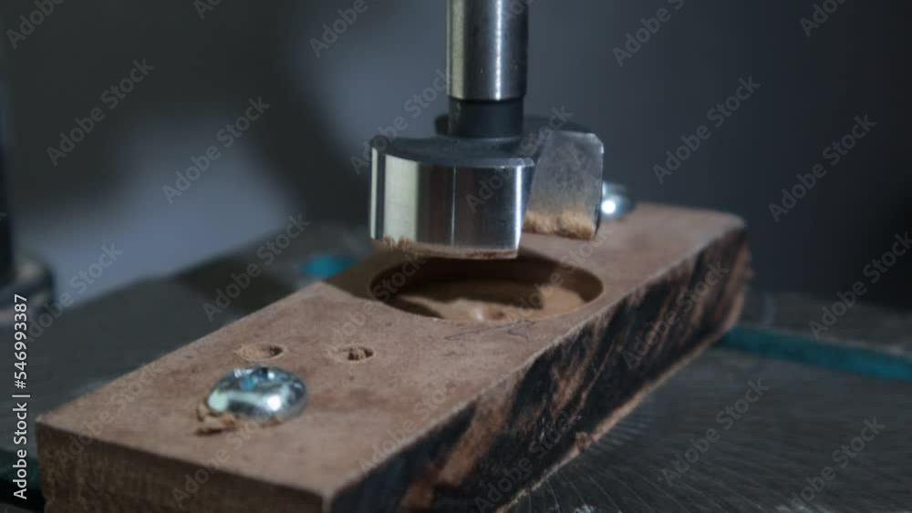 drilling a tree with a vertical drill sawdust scattering wood chips slow motion drilling a tree with a vertical drill sawdust scattering wood chips slow motion