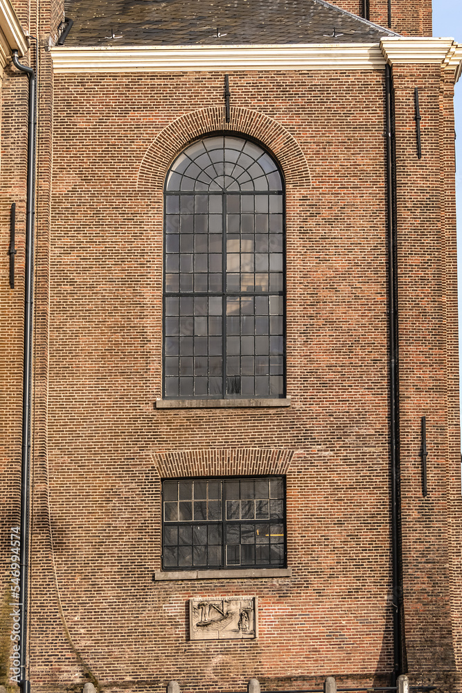 Obraz premium Oosterkerk (Eastern church) - 17th-Century Dutch Reformed church on Wittenburgergracht (Wittenburger) canal on Wittenburg in Amsterdam, The Netherlands.