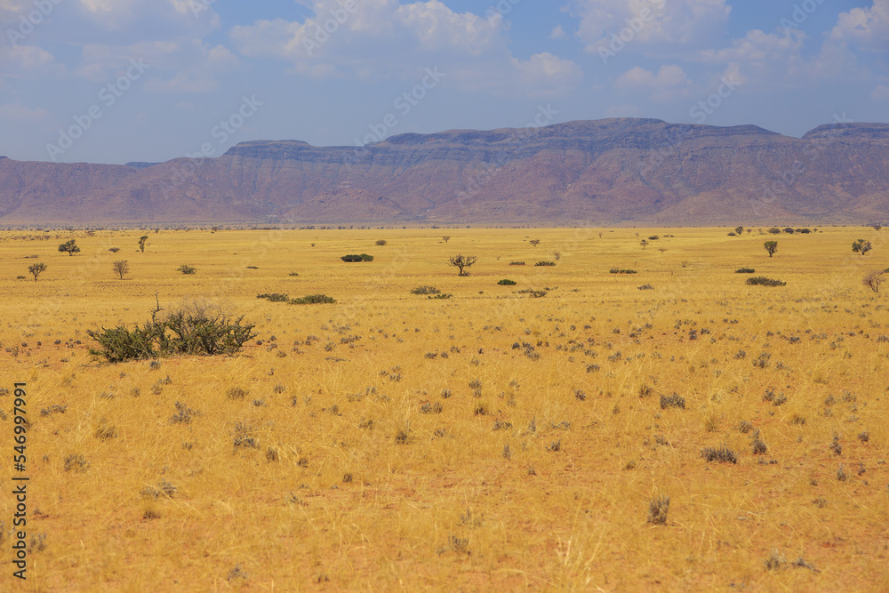 Namibian landscape along the gravel road. Sossusvlei, Namibia. Namibian landscape along the gravel road. Sossusvlei, Namibia.