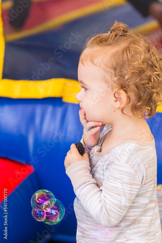 Portrait of a Toddler Girl. Curly girl's profile.