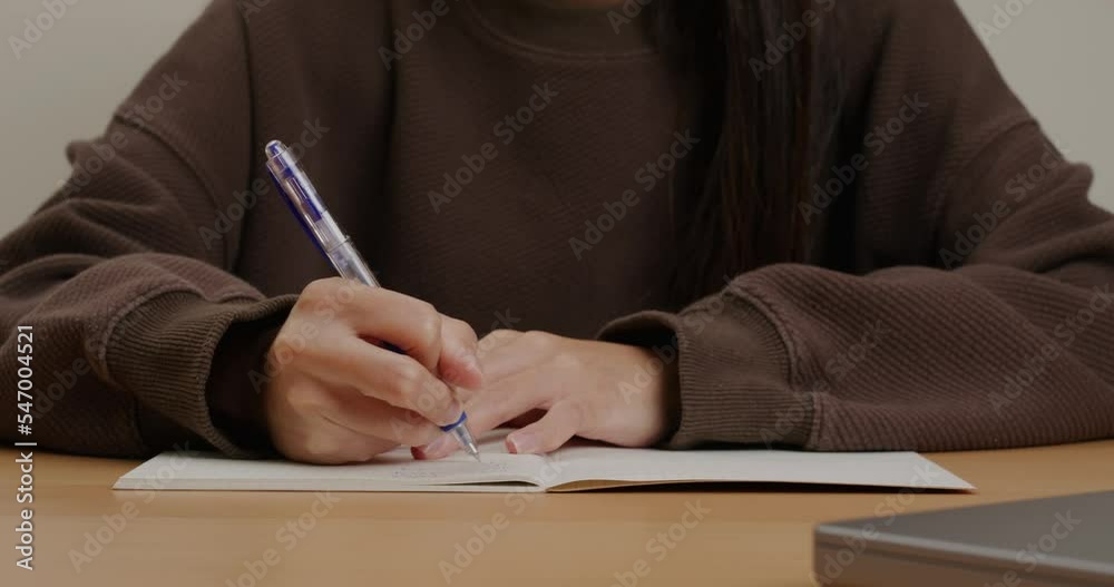 Woman write on the notebook