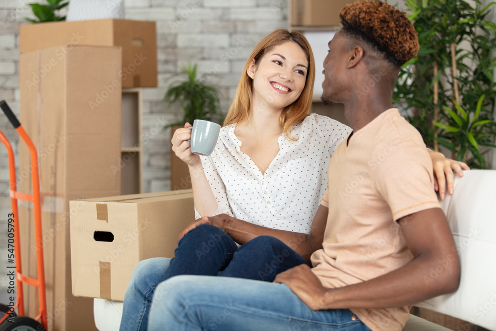 happy couple moving in a new house happy couple moving in a new house