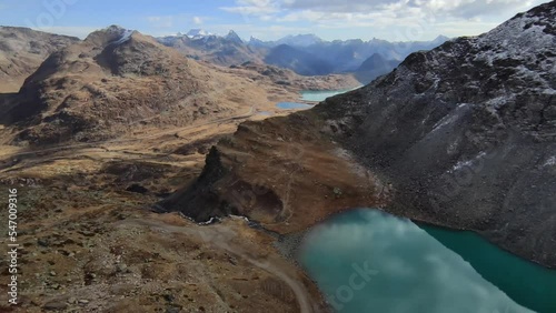 Aerial view of Lago Bianco, Bernina Pass and surrounding mountains in Graubünden canton, Switzerland.