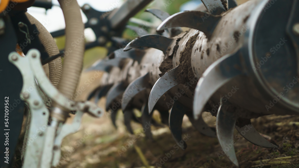 Tractor working in the field. Autumn tillage. Deep ripping with powerful tractor Tractor working in the field. Autumn tillage. Deep ripping with powerful tractor