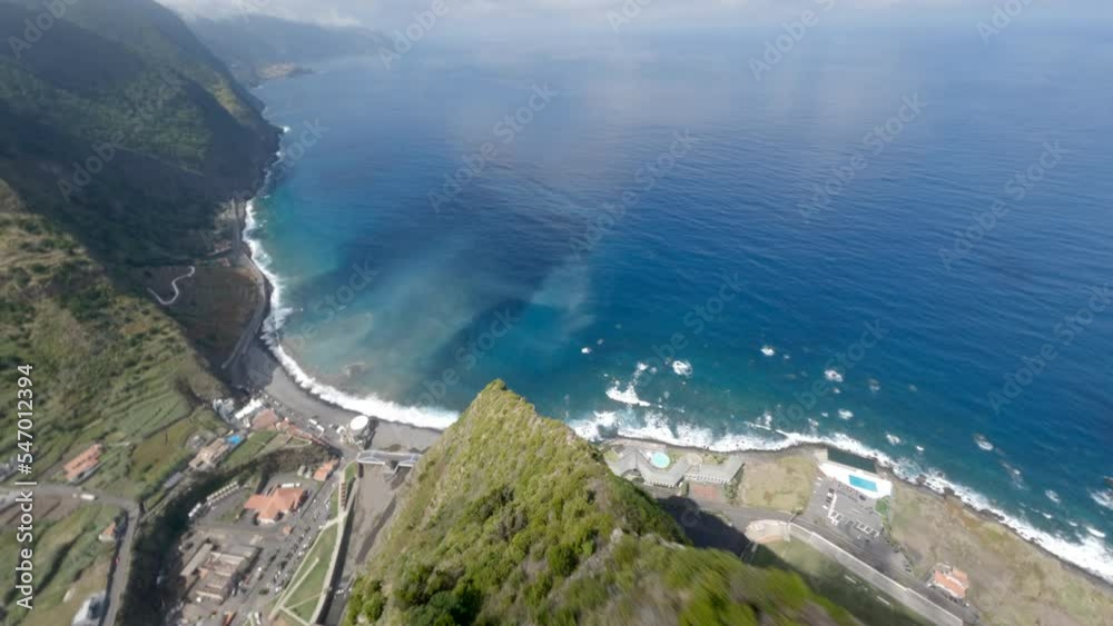 FPV drone flying over the mountains in rocky coast of Madeira, Portugal FPV drone flying over the mountains in rocky coast of Madeira, Portugal