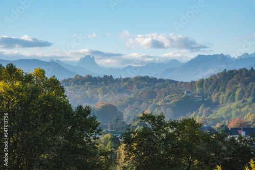 Panoramic view over the Pic du Midi d'Ossau from the Boulevard des Pyrenees in Pau / France during automn season © dronieguy