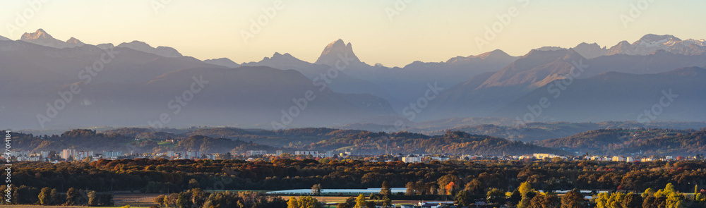 Panoramic view of Pau and the Pyrenees (Pic du Midi d'Ossau) during automn season and at sunrise. Béarn / France