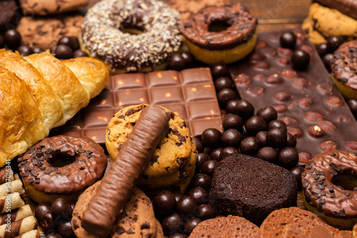 Large group of delicious pastries and chocolates