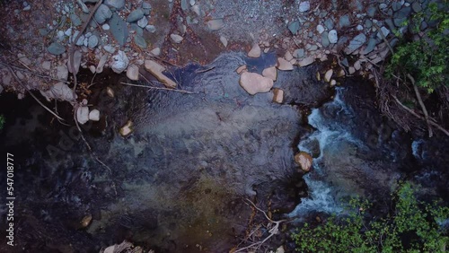 Areal drone footage from Karpenisi area, into the mountains and lake.