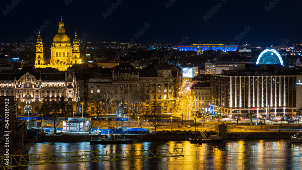 Illuminated Saint Stephen Basilica, Ferris Wheel of Budapest and Danube river. Budapest, Hungary.