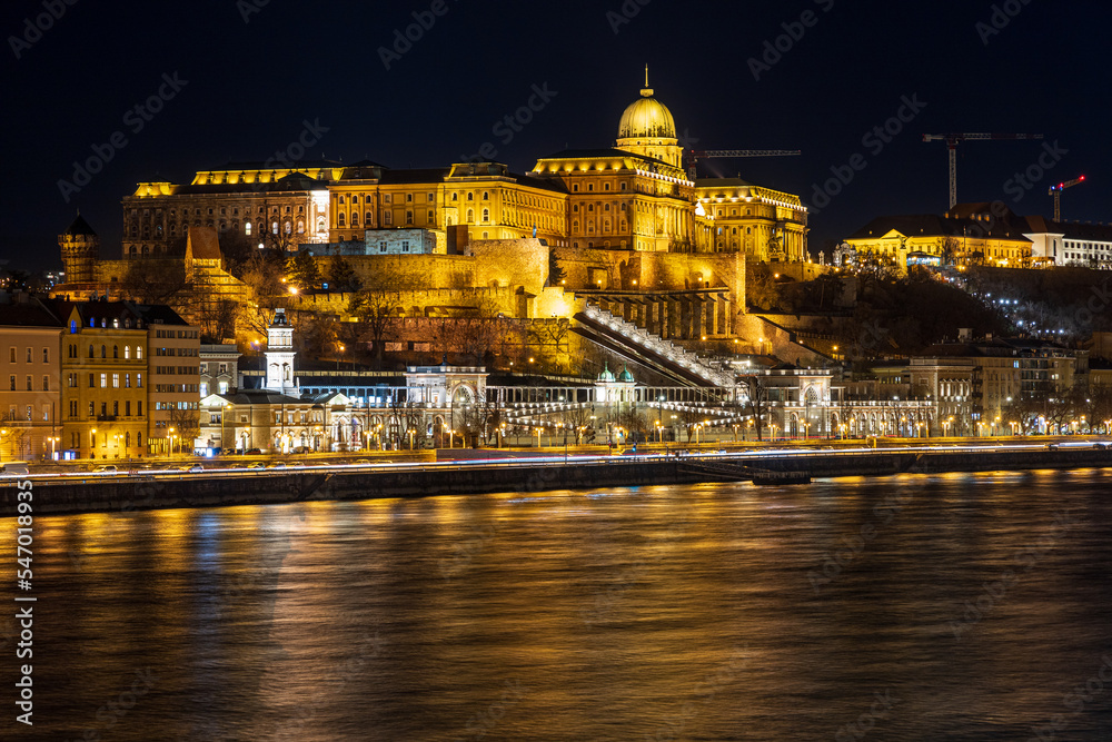 Illuminated Buda Castle and Danube river at night. Budapest, Hungary.