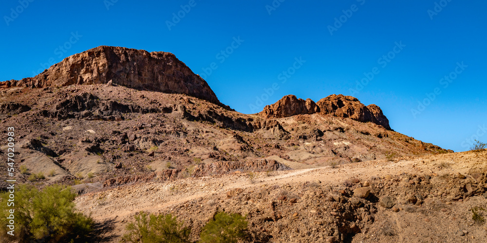 Sara Mountain Park trails arid desert landscape with red rock sandstone formation in Lake Havasu City, Arizona
