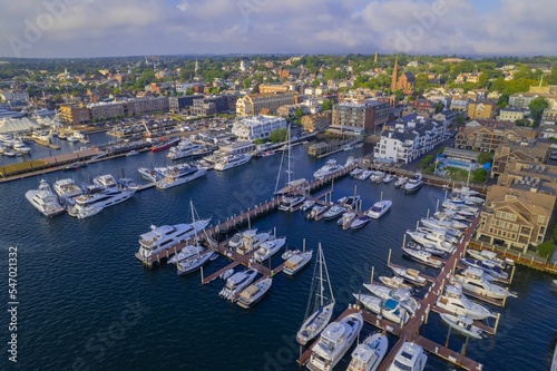 Aerial shot of the Newport Harbor in Rhode Island with ducked boats and a landscape photo