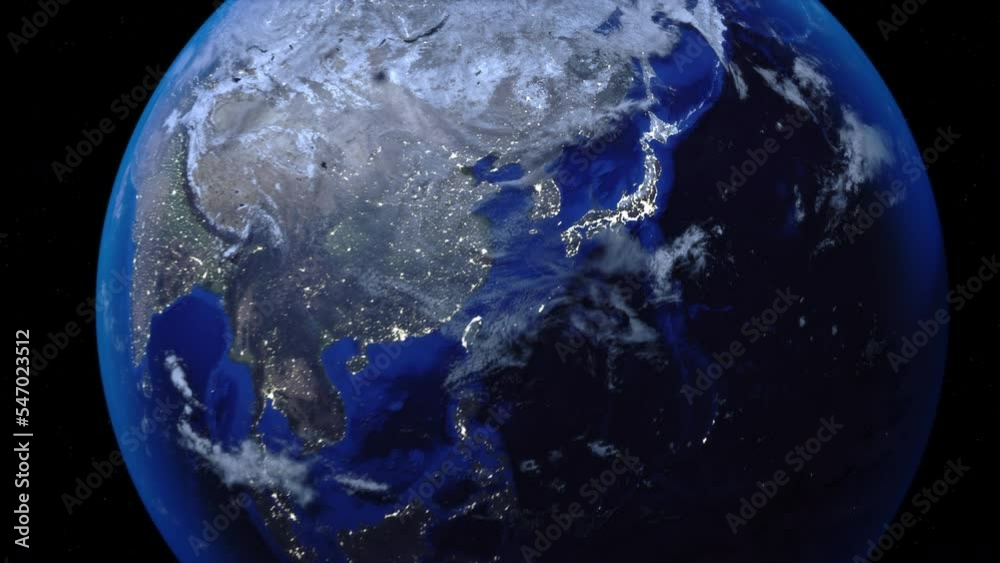 Zoom out of Japan through clouds to see the Earth from space.