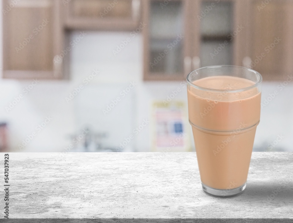 Iced tasty fresh cocoa in glass on desk Iced tasty fresh cocoa in glass on desk