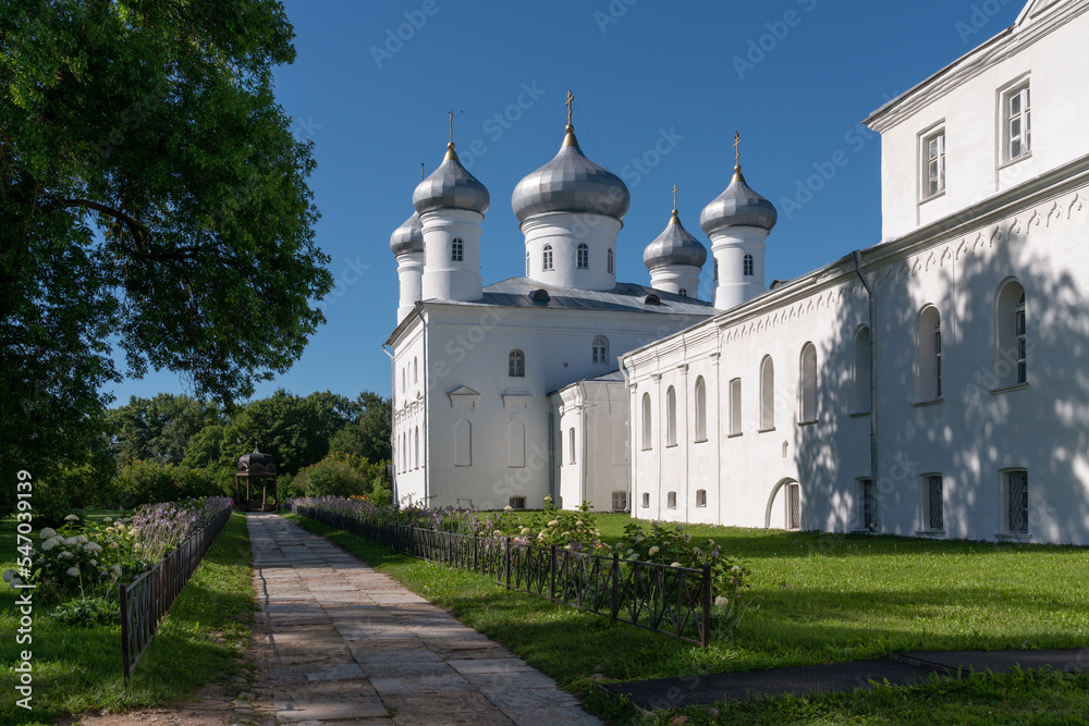 View of the Spassky Cathedral of St. George (Yuryev) Monastery and kivoriy (canopy over the spring of water) on a sunny summer day, Veliky Novgorod, Russia