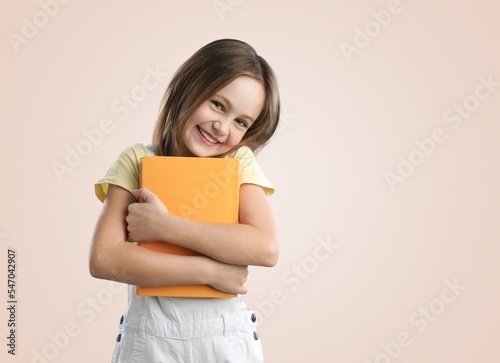 Happy young girl posing on background