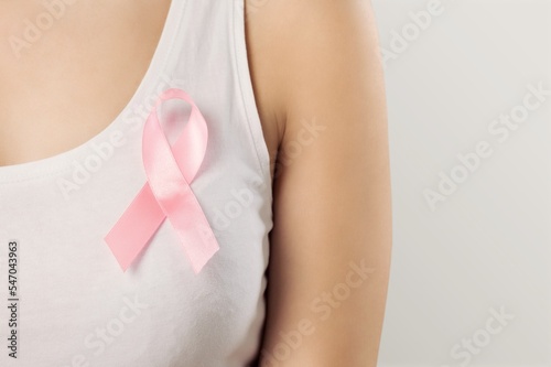 Young happy woman with pink ribbon