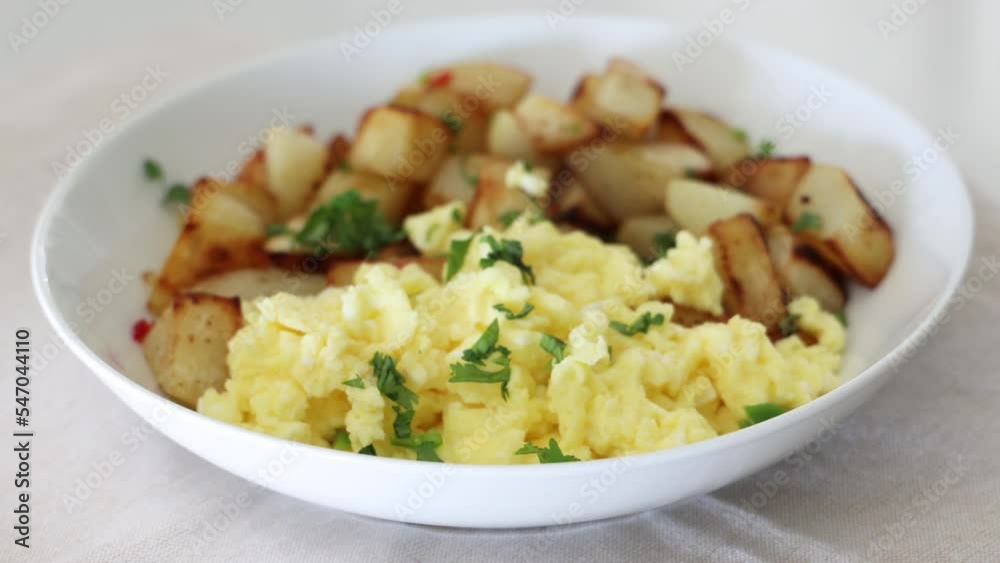 Rotating Bowl of Scrambled Eggs and Potatoes Rotating Bowl of Scrambled Eggs and Potatoes