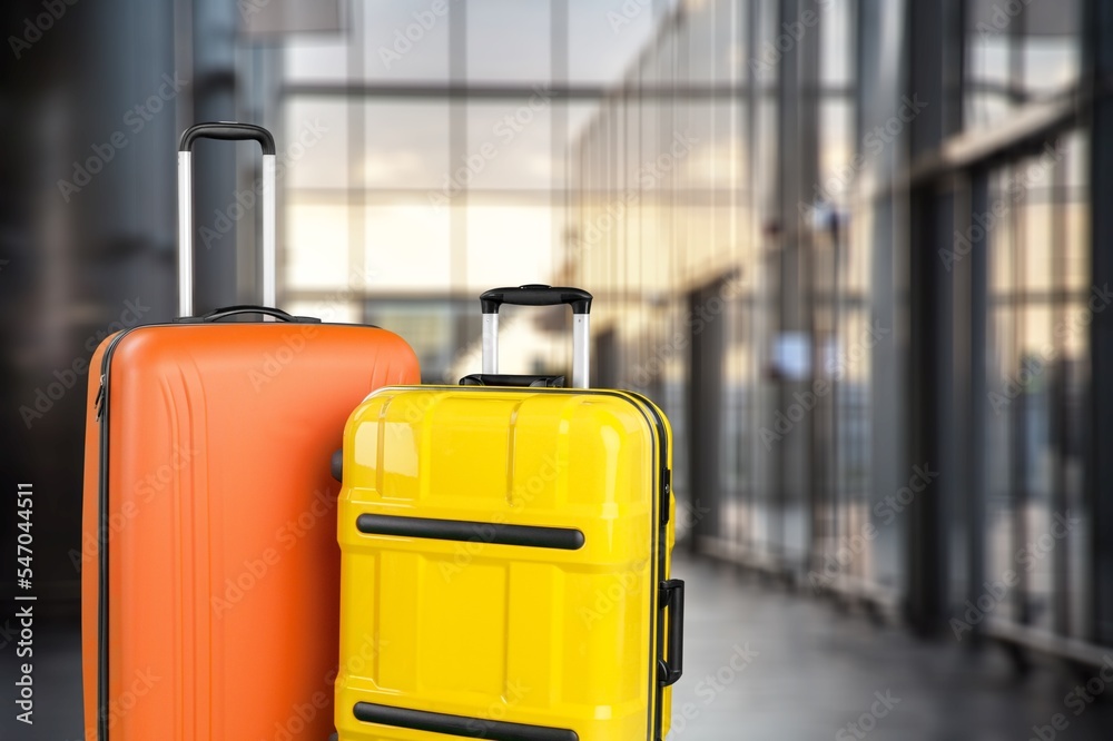 Classic travel suitcases on airport background
