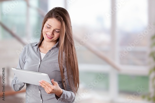 Happy young businesswoman in modern office