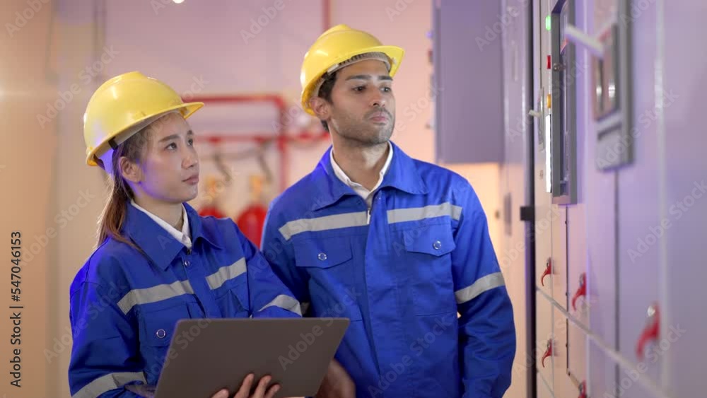 Team of engineer inspecting electric control panel. Team of engineer inspecting electric control panel.