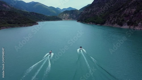 Areal drone footage from Karpenisi area, into the mountains and lake.
