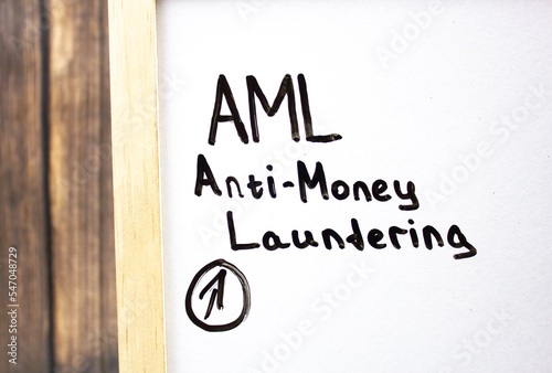 AML. Anti-Money Laundering- concept text on a white board written in black marker.