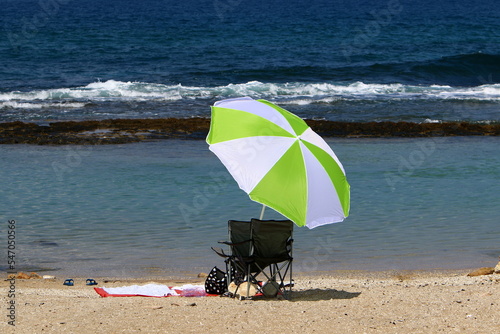 Umbrella in the city park near the sea.