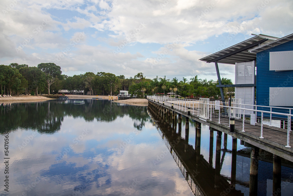 Landscape view of a marina with dramatic clouds and water reflections