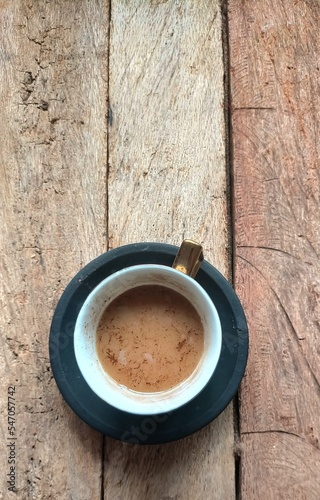 cup of coffee on wood background 
