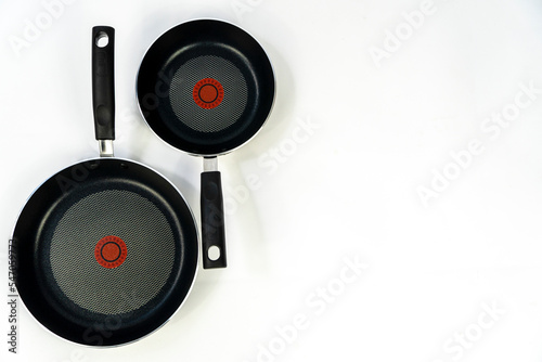 teflon cooking pans, black teflon on white background, plastic handles, mexico