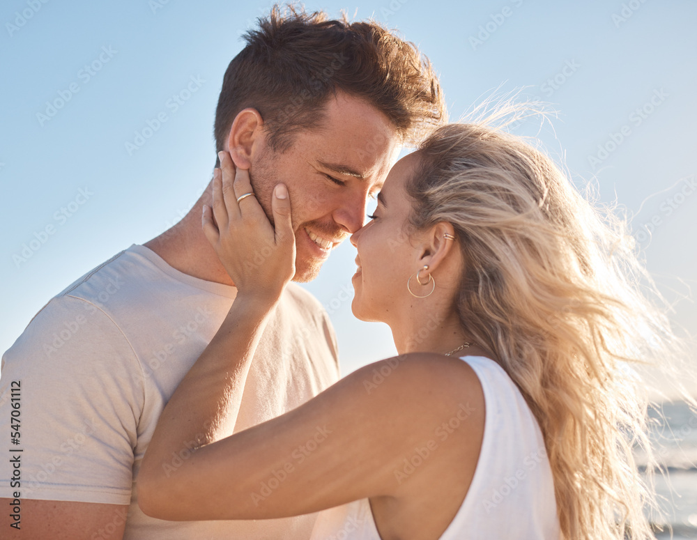 Love, couple and beach holiday, vacation or summer date and honeymoon outdoors. Affection, romance and smile of man and woman ready for kiss, having fun and enjoying quality time together at seashore Love, couple and beach holiday, vacation or summer date and honeymoon outdoors. Affection, romance and smile of man and woman ready for kiss, having fun and enjoying quality time together at seashore