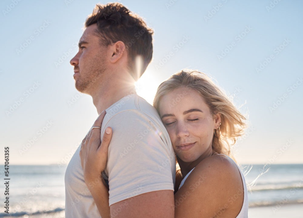Love, couple and hug on beach holiday, vacation or summer date outdoors. Affection, romance and smile of man and woman on honeymoon, embrace and enjoying quality time together at seashore or coast. Love, couple and hug on beach holiday, vacation or summer date outdoors. Affection, romance and smile of man and woman on honeymoon, embrace and enjoying quality time together at seashore or coast.