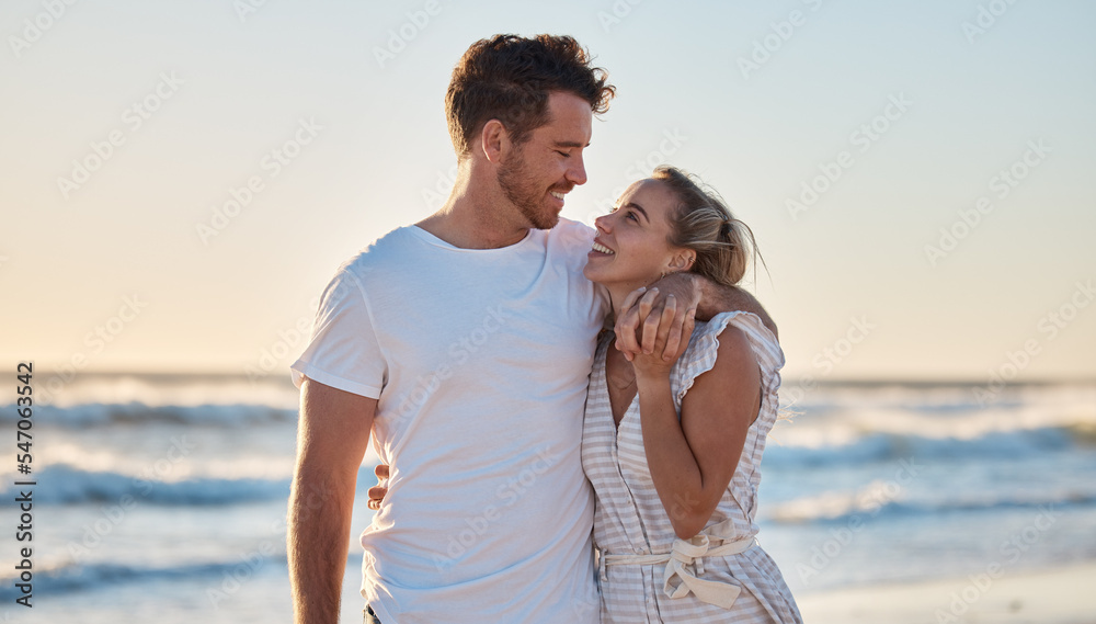 Sunset beach, love and summer with a couple hug on the sand by the sea or ocean while on holiday together. Happy, smile and romance with man and woman bonding while on travel vacation or break at sea Sunset beach, love and summer with a couple hug on the sand by the sea or ocean while on holiday together. Happy, smile and romance with man and woman bonding while on travel vacation or break at sea