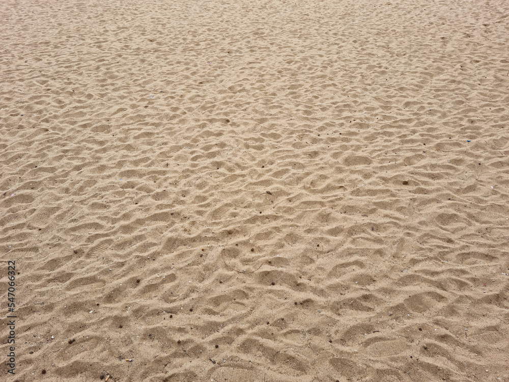 closeup of sand pattern of a beach in the summer closeup of sand pattern of a beach in the summer
