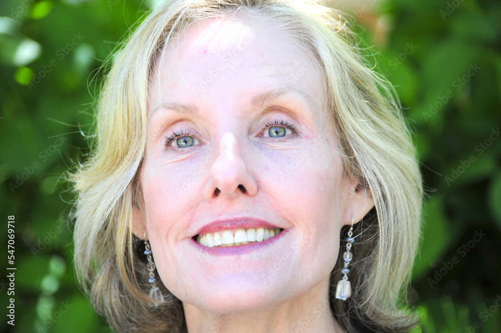 Mature female blond beauty expressions outdoors. Mature female blond beauty expressions outdoors.