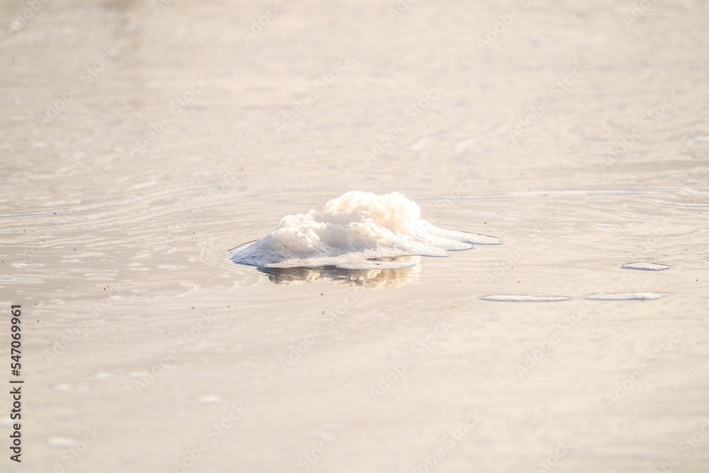 Close-up of ice floes floating on the river. Spring, snow melts, floods begin and the river overflows. Day, cloudy weather, soft warm light
