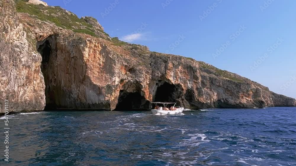 Tourboat at Punta Meliso where Ionian and Adriatic seas meet. Apulia region in Italy, slow motion Tourboat at Punta Meliso where Ionian and Adriatic seas meet. Apulia region in Italy, slow motion