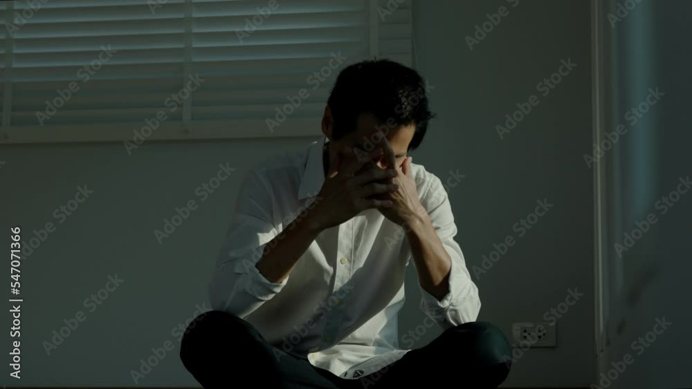 Depression and mental illness. Asian man disappoint, sad after receive bad news. Stressed boy confused with unhappy problem, arguing with girlfriend, cry and worry about unexpected work, down economy.