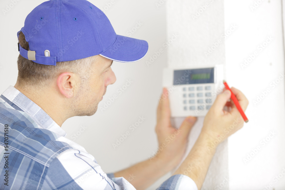 electrician during installation of wall device