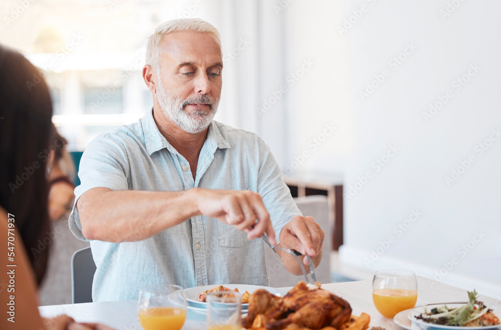 Family, turkey and senior man cut meat for brunch buffet meal, reunion celebration event or feast for hungry people. Elderly person cutting chicken protein food during quality bonding time at lunch