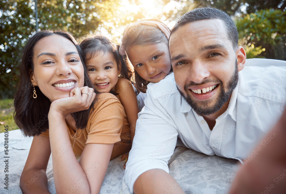 Fototapeta premium Relax, happy and selfie with family on picnic for summer, support or bonding in park. Smile, freedom and affectionate with portrait of parents and children in grass in countryside for joy and nature