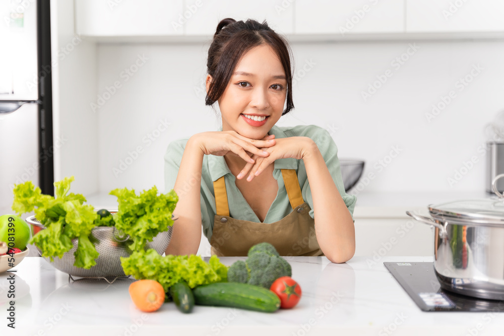Portrait of a housewife in the kitchen at home Portrait of a housewife in the kitchen at home