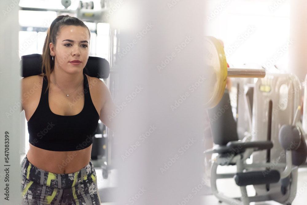 Fitness woman working out in gym. young sport female training workout Fitness woman working out in gym. young sport female training workout